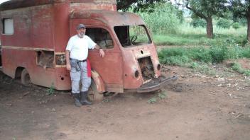 Greg next to an old truck