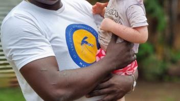 João and Lodney conduct community engagement before the March MRR in Santo Antonio, Príncipe
