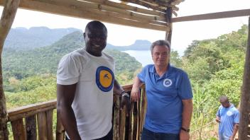 João and Lodney conduct community engagement before the March MRR in Santo Antonio, Príncipe