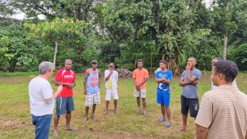 João and Lodney conduct community engagement before the March MRR in Santo Antonio, Príncipe