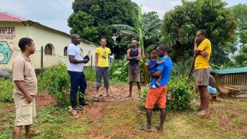João and Lodney conduct community engagement before the March MRR in Santo Antonio, Príncipe