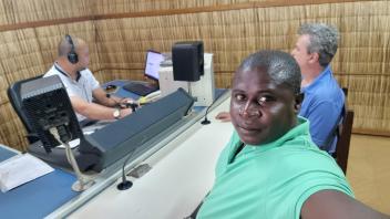 João and Lodney conduct community engagement before the March MRR in Santo Antonio, Príncipe