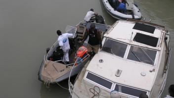 Three small boats docked to each other