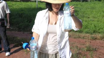 Collecting larvae from site near hospital, on Bubaque.