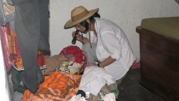 Yoosook searching for adult A. gambiae in house.
