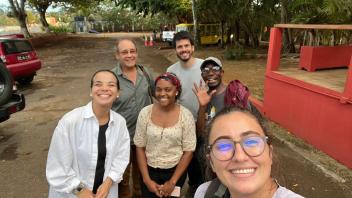 A selfie of six smiling people
