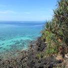 Blue water by a hill