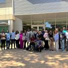Mandela scholars and Vector Genetics Lab members pose together in front of VM3B